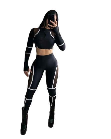 Two-piece sports set for women, long-sleeve, stretchy, with cutouts.