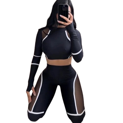 Two-piece sports set for women, long-sleeve, stretchy, with cutouts.